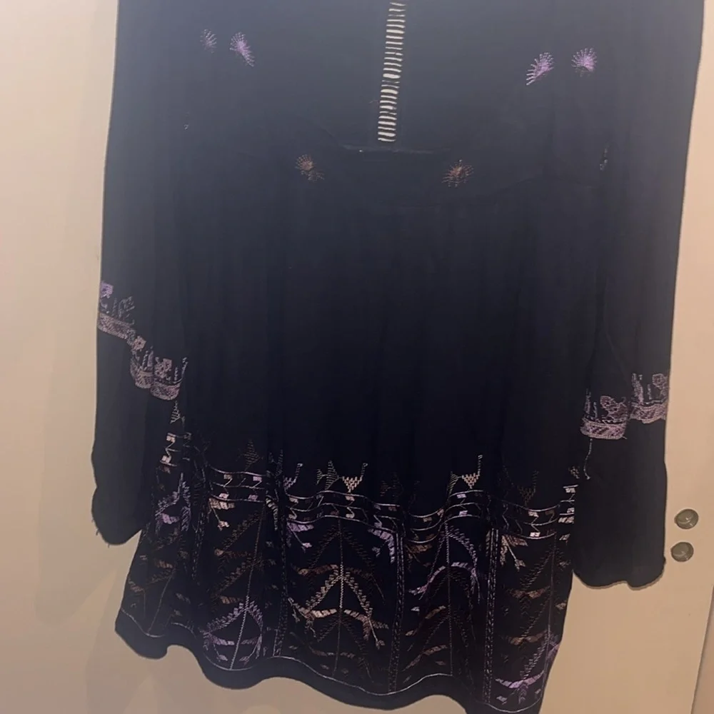 Free People black mini dress size XS with back tie and deep V bk w/ embroidery
